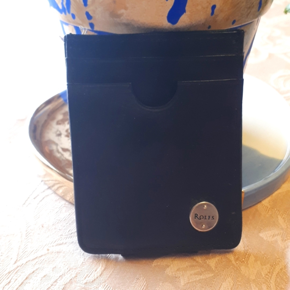 Rolfs black leather money clip with 2 slots for cards.